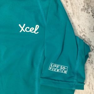 Xcel women’s rash guard nwot